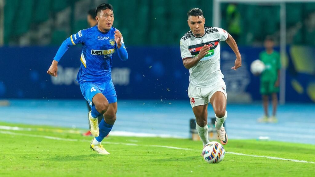 NorthEast United FC Stuns Chennaiyin FC with 3-0 Win to Seal ISL Playoff Spot 1 NEUFCs Alaaeddine Ajarie dribbling with the ball against CFCs PC Laldinpuia at Jawaharlal Nehru Stadium Chennai on Monday